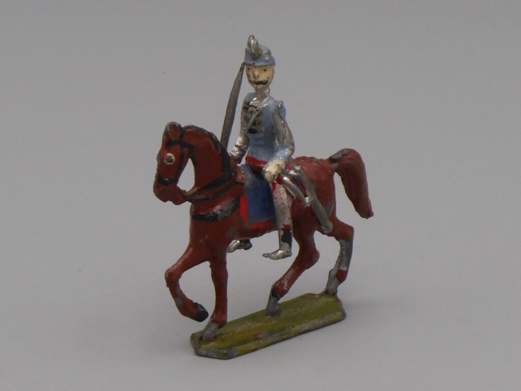 Cavalier avec sabre sur cheval marron - Plomb polychrome