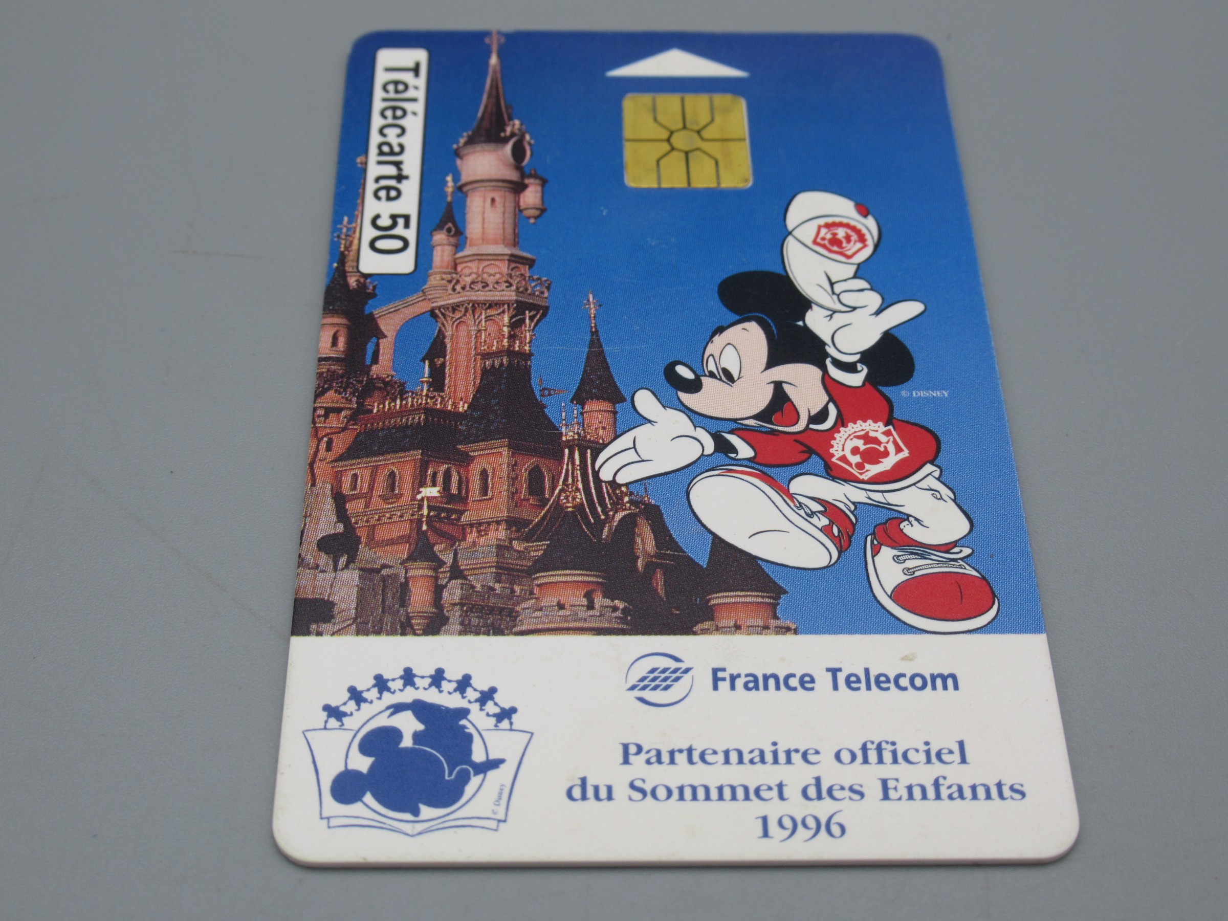 Télécarte 50 - Disneyland Partenaire du sommet des enfants 1996