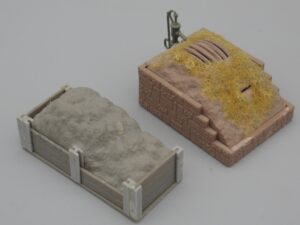 Tas de déchets et pompe à eau - Echelle H0