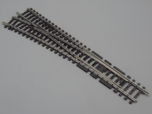 Système 3 rails - Aiguillage à gauche 22.5 cm - Märklin