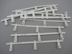 10 glissières 17 cm pour circuit routier Jouef ou Artin