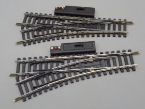 2 rails aiguillages élec. gauche 2 coup. R=385 mailchort - Jouef